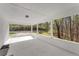Covered patio provides outdoor living space with a view of the wooded surroundings at 2374 Buchanan Hwy, Dallas, GA 30157