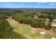 The aerial view of the property shows a golf course setting with mature trees and landscaping at 4126 Gold Mill Rdg, Canton, GA 30114
