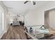 Spacious bedroom features wood flooring, desk, ceiling fan, and neutral paint at 4126 Gold Mill Rdg, Canton, GA 30114