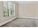 Spacious bedroom features a wall of windows with custom shutters and plush carpeting at 4126 Gold Mill Rdg, Canton, GA 30114
