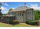 This home boasts a rear exterior with many windows, deck, and manicured landscaping at 4126 Gold Mill Rdg, Canton, GA 30114
