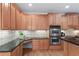 Kitchen with granite countertops, stainless steel appliances, tile backsplash and hardwood floors at 4126 Gold Mill Rdg, Canton, GA 30114