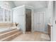 Beautiful primary bathroom with soaking tub, tiled shower, and double doors at 4126 Gold Mill Rdg, Canton, GA 30114