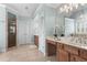 Serene primary bathroom featuring double sinks, soaking tub, and glass-enclosed shower at 4126 Gold Mill Rdg, Canton, GA 30114