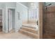 Relaxing main bathroom showcasing a soaking tub, tiled shower, and calming decor at 4126 Gold Mill Rdg, Canton, GA 30114