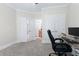A home office with desk, computer, two closets, and carpet floors at 4126 Gold Mill Rdg, Canton, GA 30114