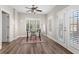 Bright office featuring laminate wood floors, ceiling fan, window with plantation shutters, and glass top desk at 4126 Gold Mill Rdg, Canton, GA 30114