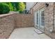 Outdoor patio with brick walls and a welcome mat at the door at 4126 Gold Mill Rdg, Canton, GA 30114