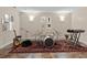 This room is staged with instruments on top of a patterned area rug at 4126 Gold Mill Rdg, Canton, GA 30114
