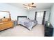 Comfortable bedroom with neutral carpet, a large window, dresser and closet at 5400 Roswell Rd # K2, Atlanta, GA 30342