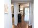 Hallway leading to a bedroom and living room with hardwood floors at 5400 Roswell Rd # K2, Atlanta, GA 30342