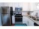 Updated kitchen features stainless steel appliances, granite countertops, and ample white cabinetry at 5400 Roswell Rd # K2, Atlanta, GA 30342