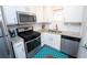 Updated kitchen features stainless steel appliances, granite countertops, and ample white cabinetry at 5400 Roswell Rd # K2, Atlanta, GA 30342