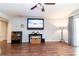 Bright living room featuring hardwood floors, a ceiling fan and sliding glass doors to the outside at 5400 Roswell Rd # K2, Atlanta, GA 30342