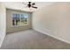 Bedroom with neutral carpet, ceiling fan, and a window at 1005 Magnolia Gardens Walk, Mcdonough, GA 30253