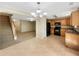 Open concept kitchen and dining area featuring maple cabinets and breakfast bar at 1005 Magnolia Gardens Walk, Mcdonough, GA 30253