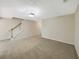 Spacious living room with neutral carpet and a staircase leading to the upper level at 1005 Magnolia Gardens Walk, Mcdonough, GA 30253