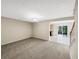 Open living room with a view to the kitchen and dining area, and a staircase at 1005 Magnolia Gardens Walk, Mcdonough, GA 30253