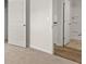 Comfortable bedroom with neutral carpeting and a view into the on-suite bathroom at 104 Hill Side Ln, Dallas, GA 30157