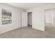 Clean bedroom with neutral carpet and closet at 104 Hill Side Ln, Dallas, GA 30157