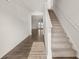 Bright foyer with hardwood floors, stairs, and an open view to the living area at 104 Hill Side Ln, Dallas, GA 30157