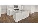 Modern kitchen featuring a large island with granite countertops and stainless steel appliances at 104 Hill Side Ln, Dallas, GA 30157