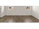 Spacious living room with hardwood floors and plenty of natural light at 104 Hill Side Ln, Dallas, GA 30157