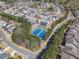 A well-planned residential community featuring tree-lined streets, lush greenery, and amenities like tennis courts at 307 Montgomery Way, Woodstock, GA 30188