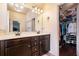 Bathroom with double sink vanity and a walk-in closet, offering plenty of storage space at 307 Montgomery Way, Woodstock, GA 30188