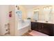 Bright bathroom with a separate shower and soaking tub as well as a double sink vanity at 307 Montgomery Way, Woodstock, GA 30188