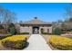 Community clubhouse featuring a gated entrance and well maintained landscaping at 307 Montgomery Way, Woodstock, GA 30188