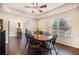 Traditional dining room with hardwood floors, a ceiling fan, and large window offering natural light at 307 Montgomery Way, Woodstock, GA 30188