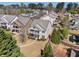 Charming two-story home with a balcony, complemented by manicured landscaping and mature trees in a vibrant community at 307 Montgomery Way, Woodstock, GA 30188