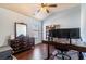 Office with hardwood floors, a ceiling fan, a built-in bookshelf and a large desk space at 307 Montgomery Way, Woodstock, GA 30188