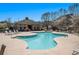 Community swimming pool featuring lounge chairs and mature trees on a sunny day at 307 Montgomery Way, Woodstock, GA 30188