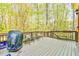 Large wooden back deck with grill, outdoor seating and wooded views at 3816 Berrybridge Se Way, Marietta, GA 30067
