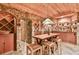 Unique basement with stone walls, a wood ceiling, and a bar area at 3816 Berrybridge Se Way, Marietta, GA 30067