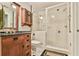 Updated bathroom features a dark granite countertop, custom vanity, glass shower with custom tile at 3816 Berrybridge Se Way, Marietta, GA 30067