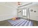Bedroom featuring neutral walls, a window with curtains, and wood flooring at 3816 Berrybridge Se Way, Marietta, GA 30067