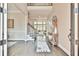 Elegant foyer with hardwood floors, a staircase, and views into the living room at 3816 Berrybridge Se Way, Marietta, GA 30067