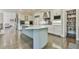 Bright kitchen with stainless appliances, a large center island and plenty of white cabinets at 3816 Berrybridge Se Way, Marietta, GA 30067