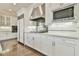 Clean, neutral-toned kitchen featuring white cabinets, stainless steel appliances, and recessed lighting at 3816 Berrybridge Se Way, Marietta, GA 30067