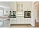 Kitchen featuring neutral-toned walls, stainless appliances, and oversized, white cabinetry at 3816 Berrybridge Se Way, Marietta, GA 30067