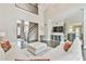 Bright living room featuring soaring ceilings, a staircase, and comfortable white couches at 3816 Berrybridge Se Way, Marietta, GA 30067