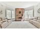 The living room features a brick fireplace, neutral-toned walls, and oversized windows at 3816 Berrybridge Se Way, Marietta, GA 30067