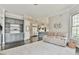 Open-concept living room with decorative built-ins, an oversized carpet, and hardwood floors at 3816 Berrybridge Se Way, Marietta, GA 30067