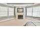 Cozy main bedroom sitting area with fireplace and lots of light at 3816 Berrybridge Se Way, Marietta, GA 30067