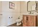 Stylish powder room featuring shiplap walls, wood vanity, and modern fixtures at 3816 Berrybridge Se Way, Marietta, GA 30067