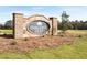 Oakleigh Glen community entrance sign featuring brick pillars and manicured lawn at 102 Hill Side Ln, Dallas, GA 30157