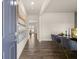 Hallway with wood floors leads to a formal dining area featuring a glass table at 102 Hill Side Ln, Dallas, GA 30157